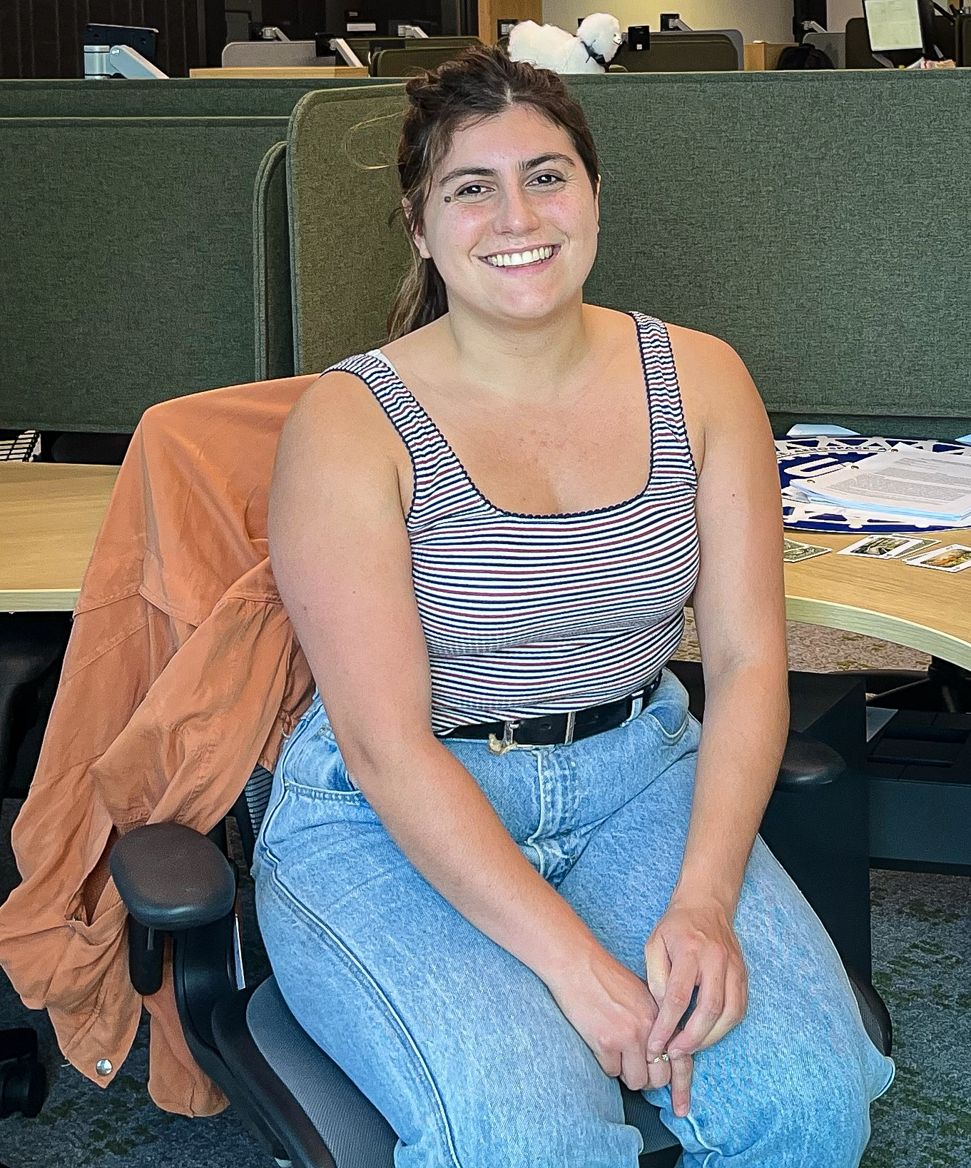 A smiling woman sitting in an office