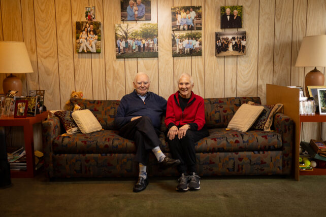 SuperAger Ralph Rehbock sits with his wife in his home.