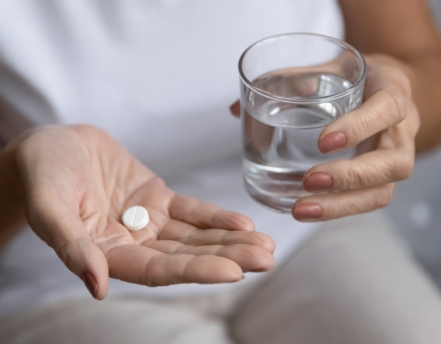 Close up of senior woman having meds