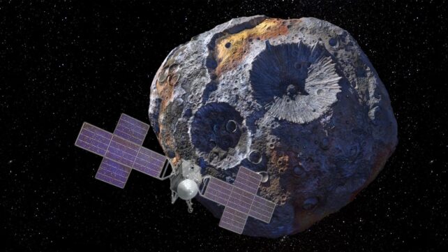 An asteroid behind a spacecraft