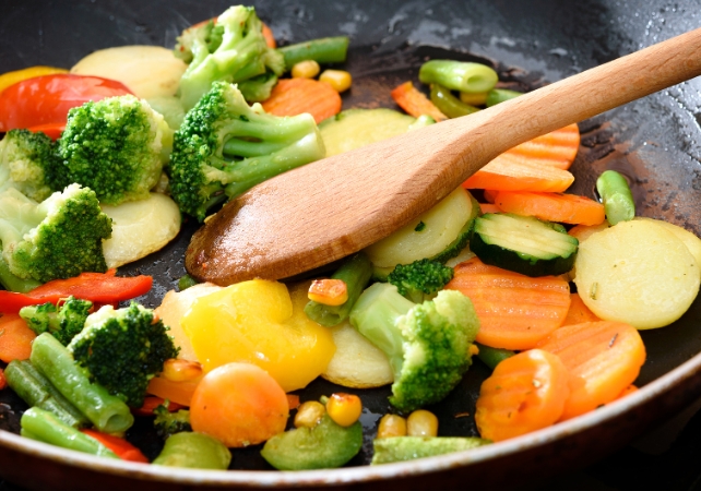 cooking vegetables in a frying pan