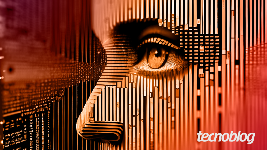 Uma ilustração digital em tons de laranja e marrom escuro, representando inteligência artificial. O olho direito está em foco e o nariz e a bochecha são formados por linhas retas e blocos, como se a imagem estivesse sendo construída por pixels e códigos. À esquerda e ao fundo, linhas e números de programação em alto-relevo se estendem por toda a imagem, que possui um gradiente de tons quentes, do mais claro ao mais escuro. No canto inferior direito, o logotipo "tecnoblog" aparece em branco.