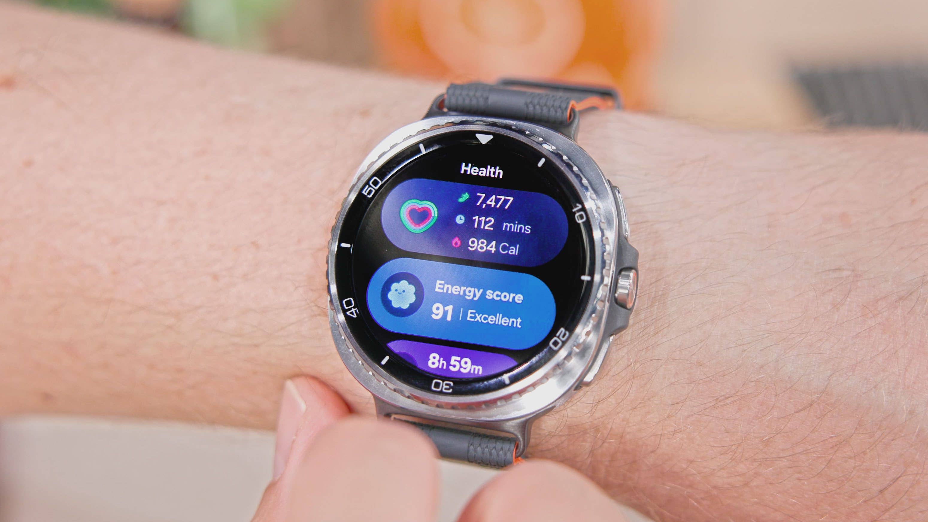 Samsung Galaxy Watch 8 Classic displaying health stats: steps, calories, and energy score.