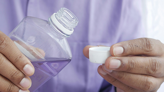Pouring mouthwash