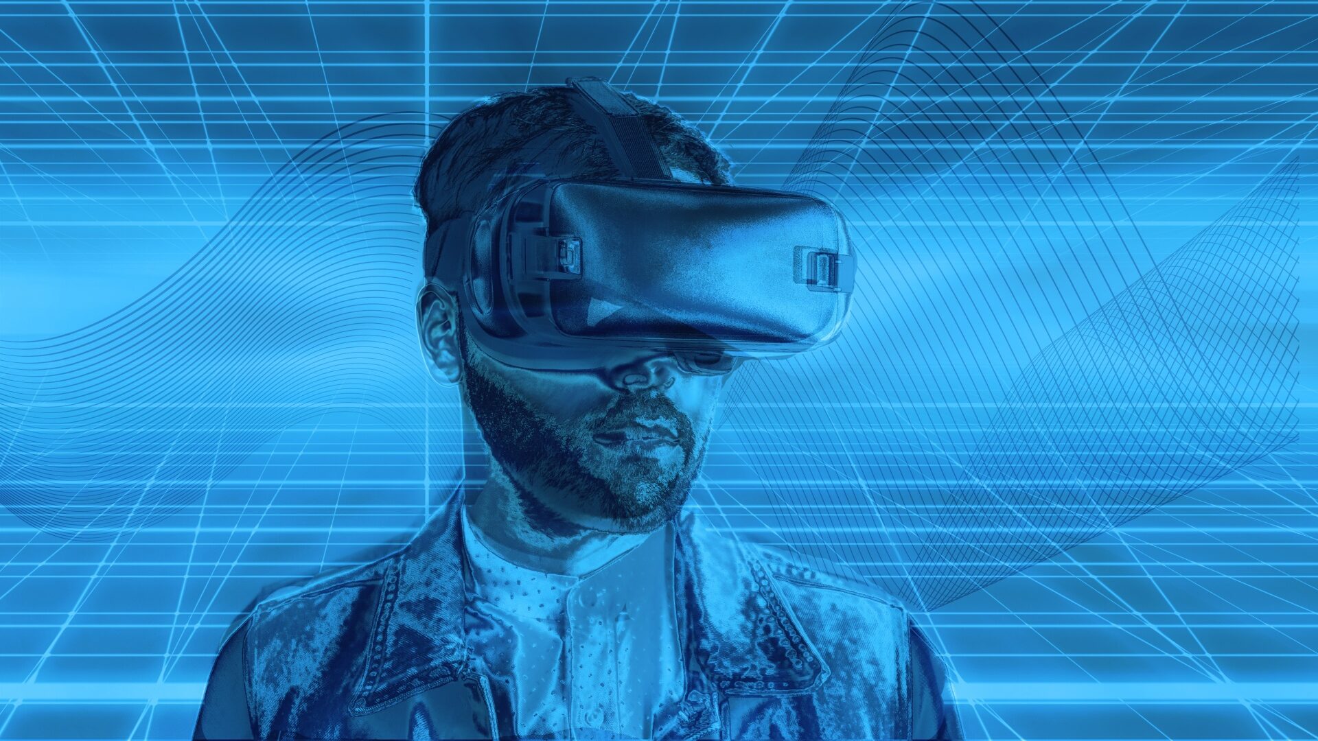 Imagem mostra um homem com um óculos de realidade virtual. A arte é em tom azul, com detalhes futuristas 