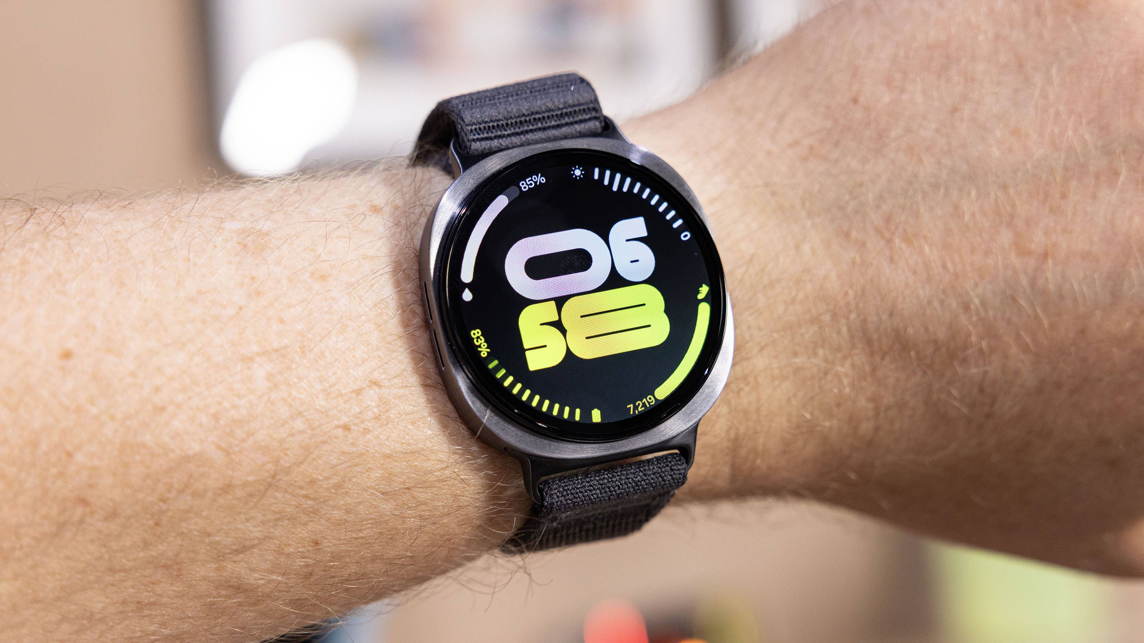 A Samsung Galaxy Watch 8 displaying the time 06:58 with a black strap.