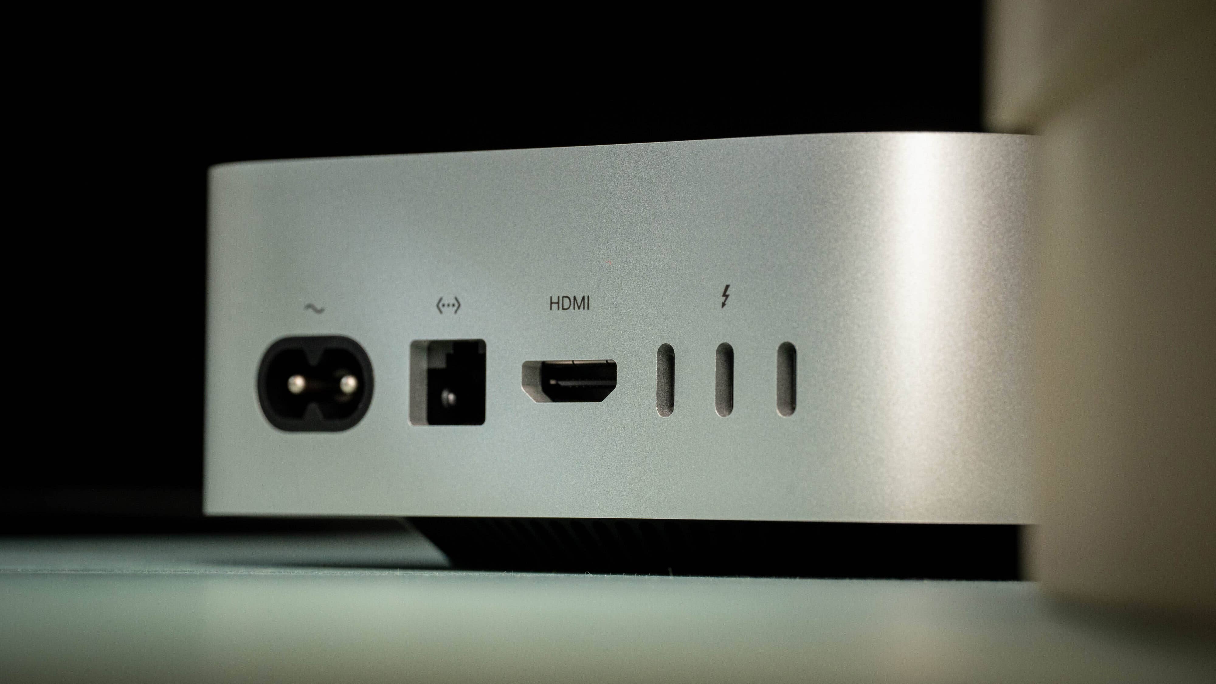 Close-up of the ports on the back of an Apple Mac Mini M4 (2024) including HDMI and power connections.