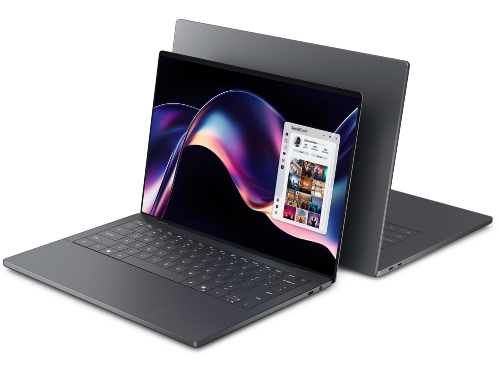 Dois notebooks da linha XPS aparecem parcialmente sobrepostos, ambos abertos. O modelo à frente mostra a tela ligada com uma imagem abstrata colorida e uma janela de aplicativo aberta, com o título “Social” no topo e miniaturas de fotos abaixo. O teclado é amplo e sem destaque para bordas. O notebook ao fundo mostra a parte traseira da tela e a base, ambos em acabamento escuro, destacando o design fino e premium.