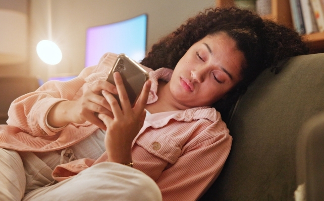 woman scrolling on her phone