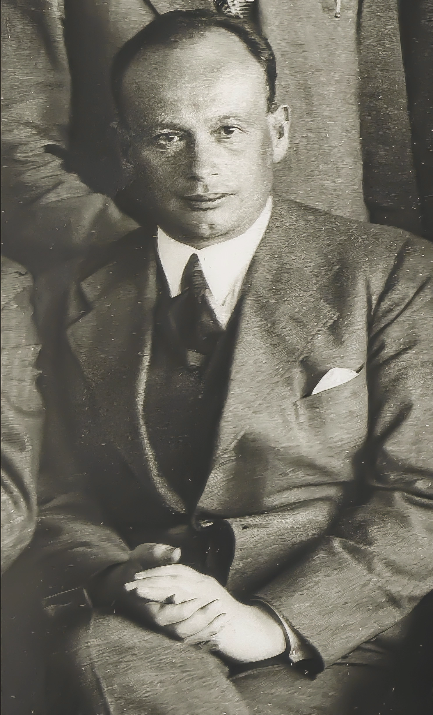 Black-and-white photograph of a man in a suit.
