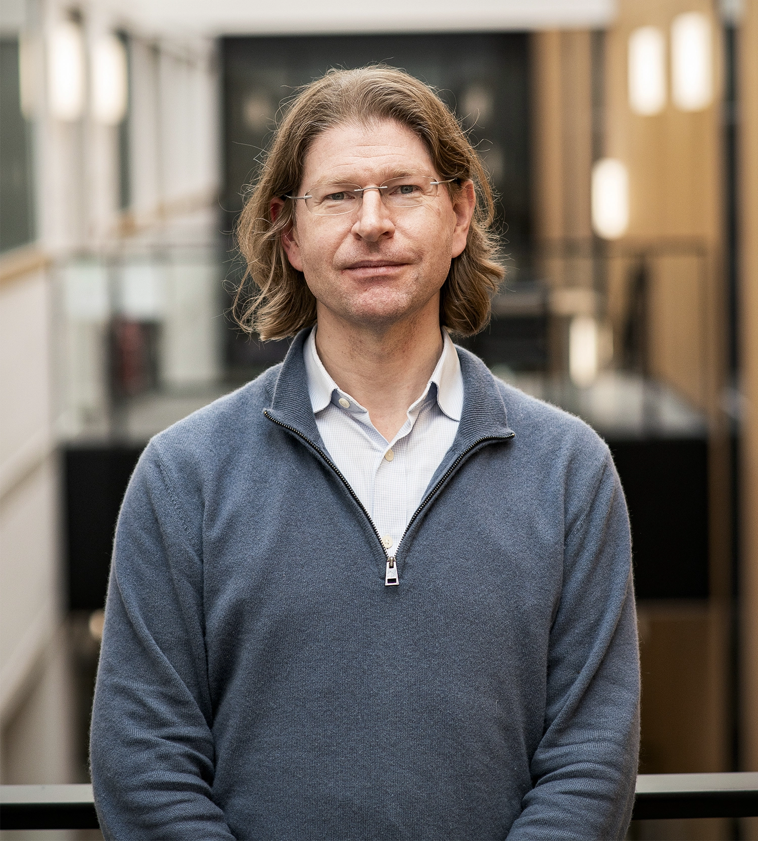 Portrait of a man with glasses in a sweater