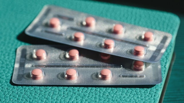 hrt blister packs on a green bench 