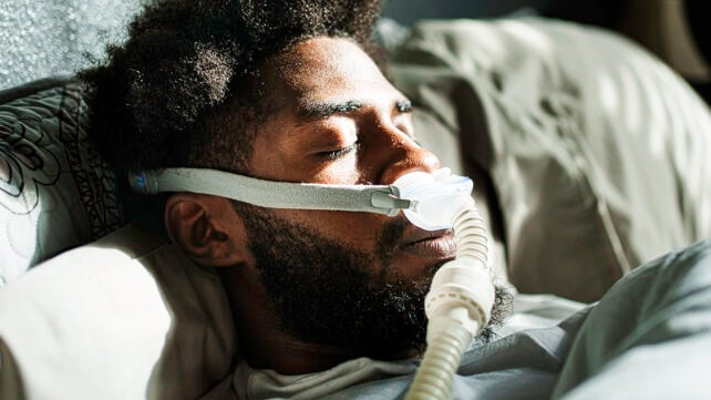 Man with a CPAP mask