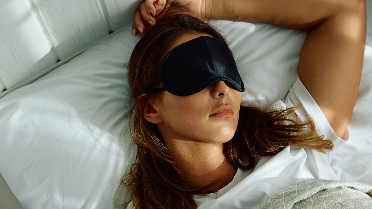 High angle view of woman wearing sleeping eye mask
